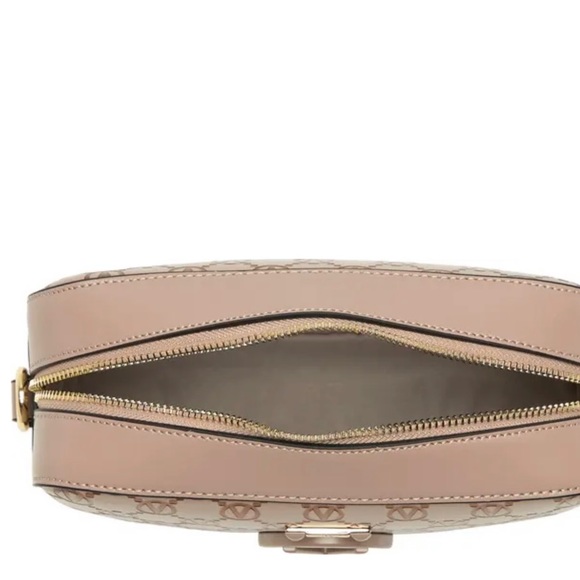 A gleaming monogram logo details this chic crossbody bag. - Picture 2 of 3